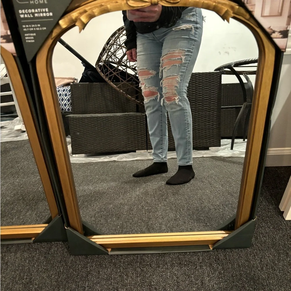Gold bow mirror size is 18 x 24